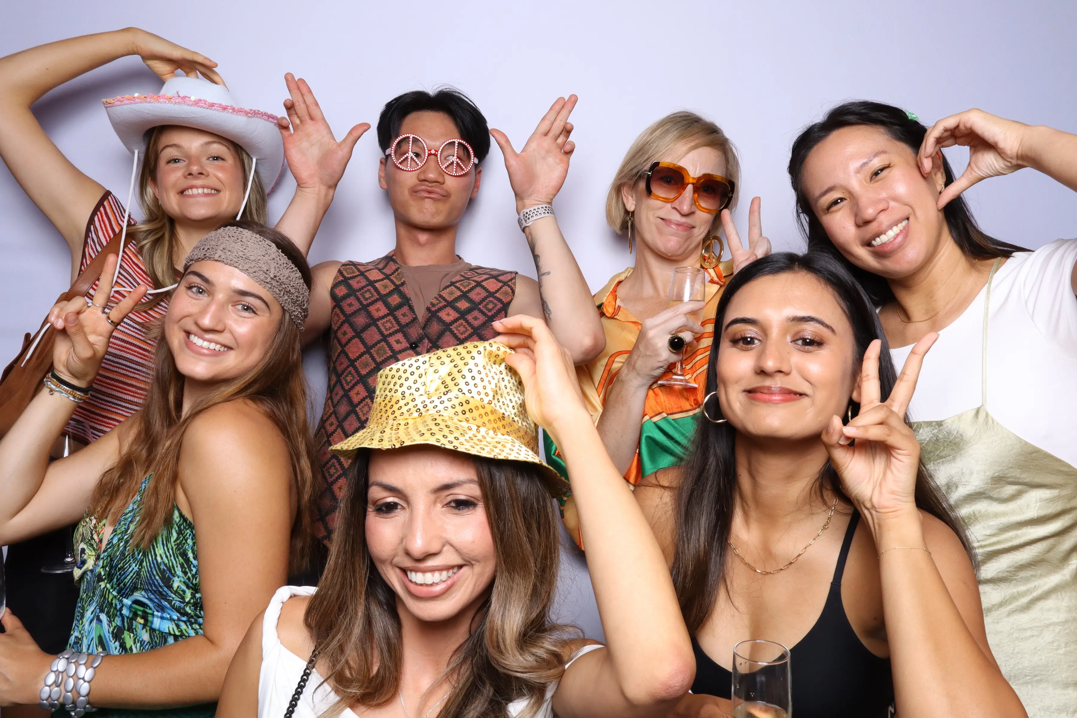Students celebrating their graduation with a fun photobooth